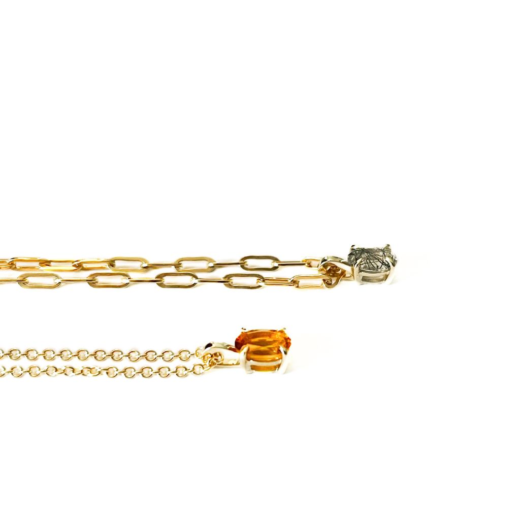 9ct gold oval pendant necklace; Black Rutilated Quartz, Citrine