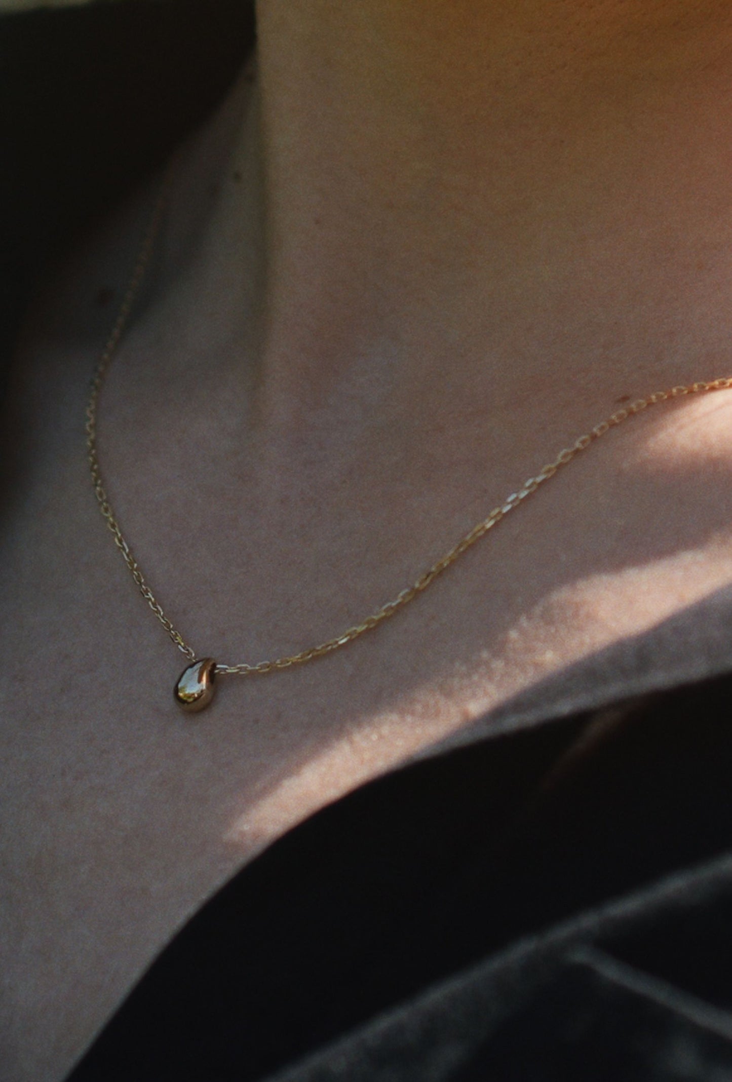 9carat gold necklace with teardrop pendant by Thor Collective