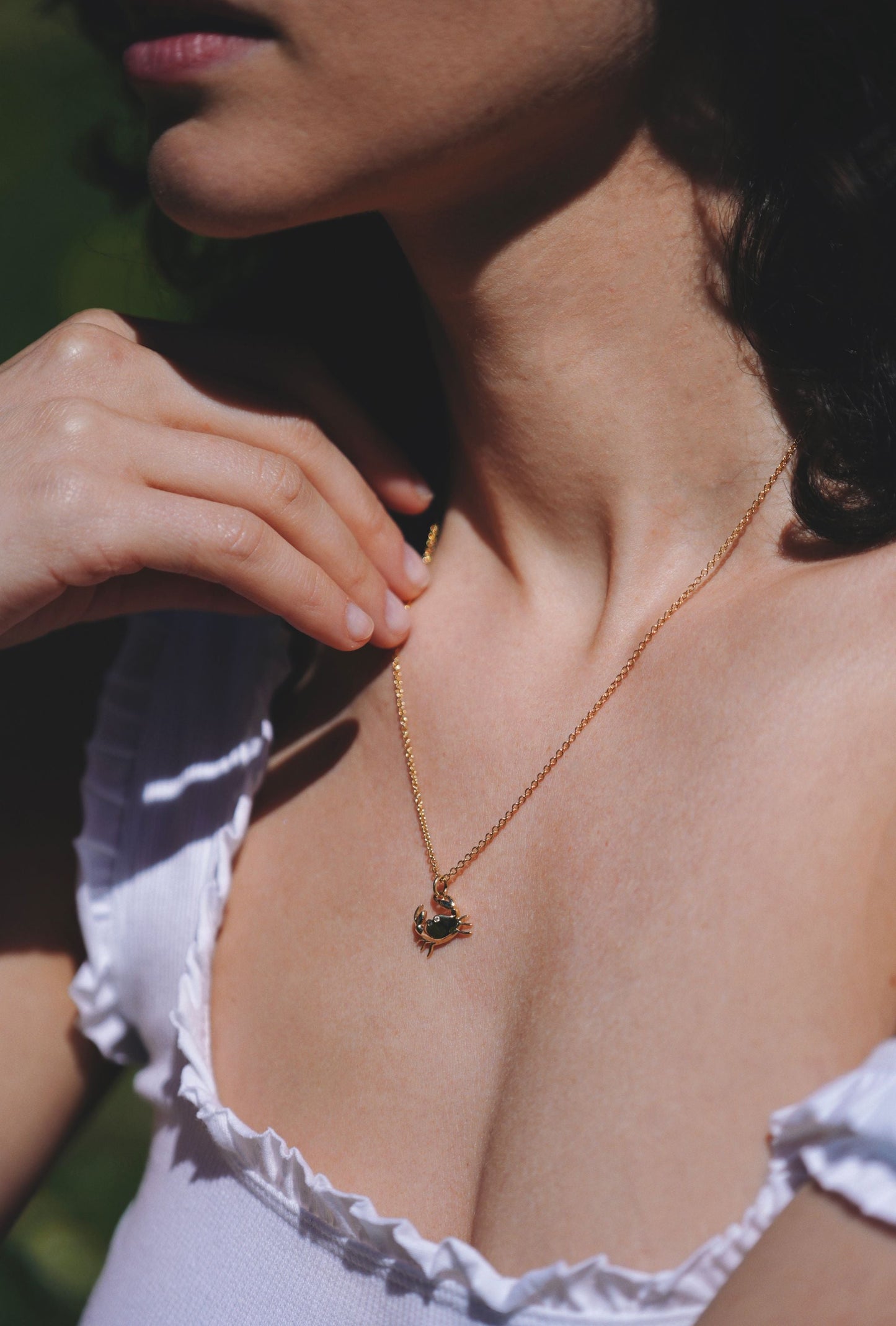 gold and natural white diamond necklace with crab pendant