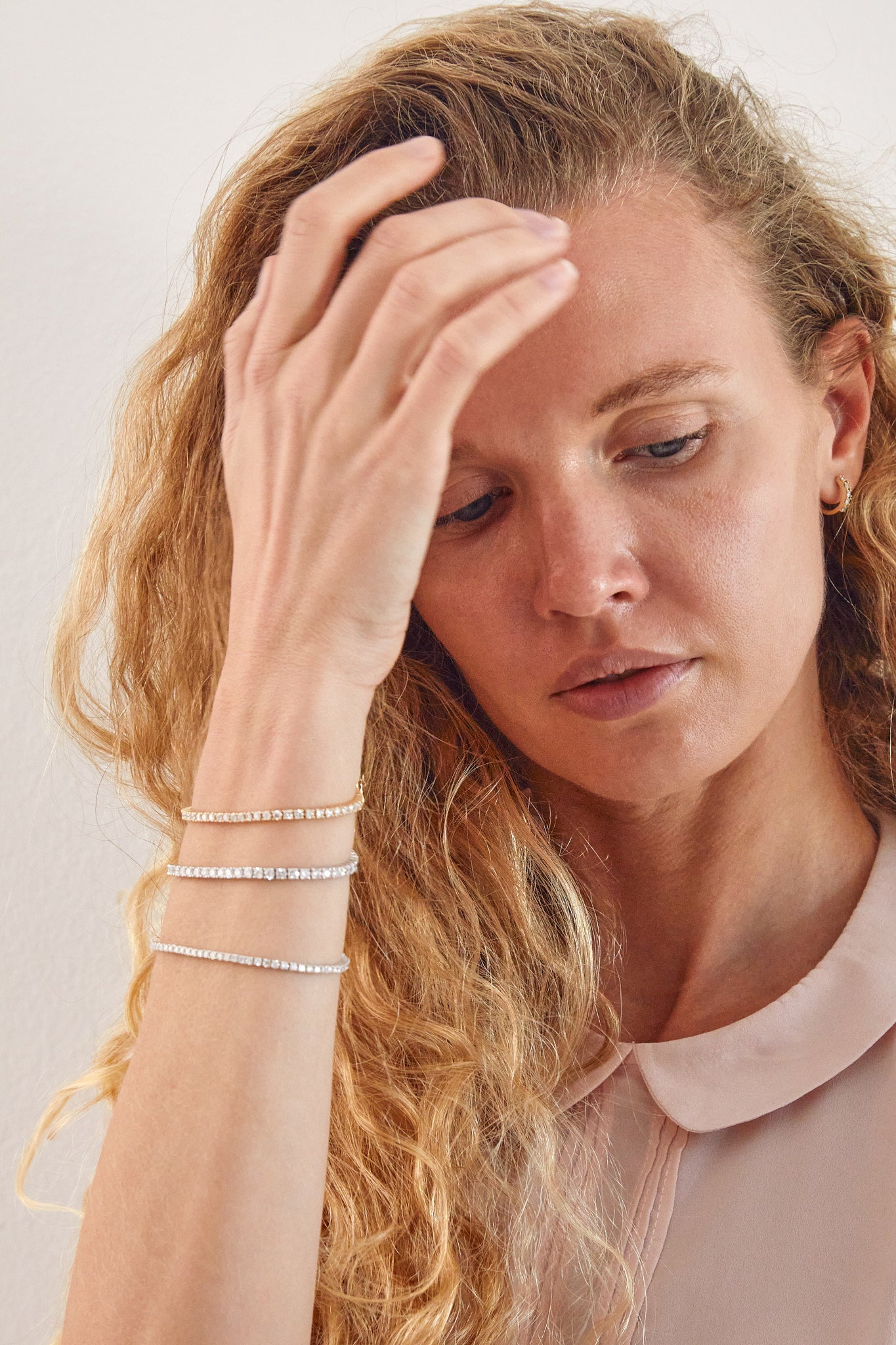 Lifestyle shot of model wearing Thor Collective diamond tennis bracelets