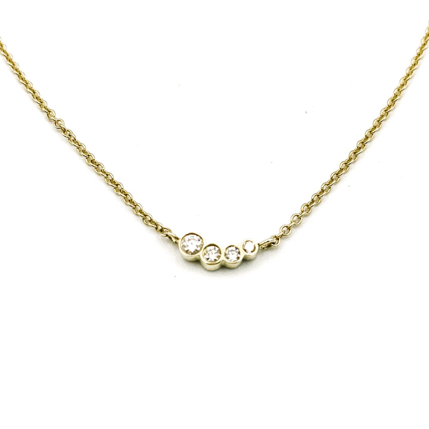solid gold necklace with four diamonds in setting by Thor Collective