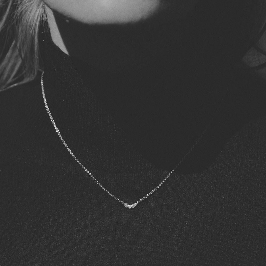 woman wearing 9ct gold pixi necklace