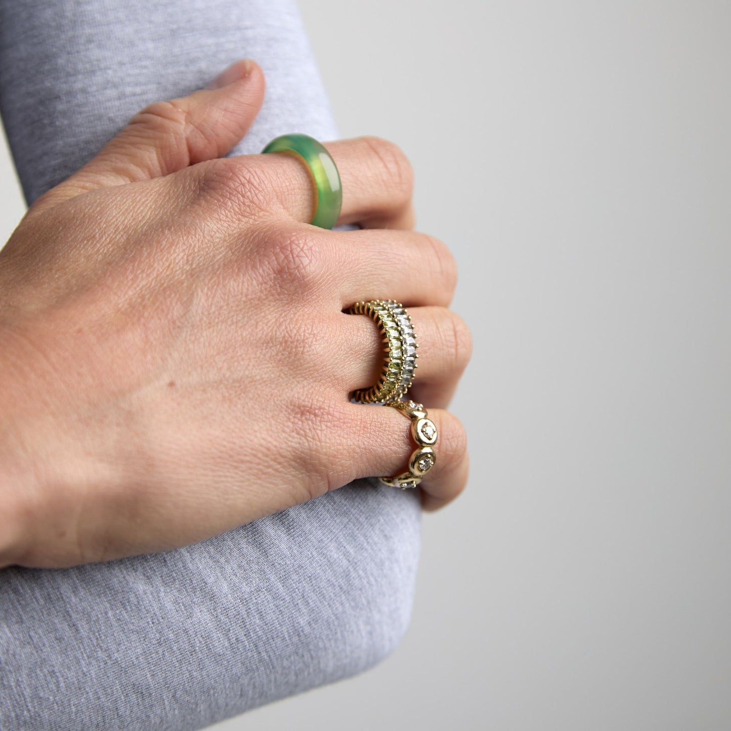 Green agate cigar band paired with gold and diamond rings
