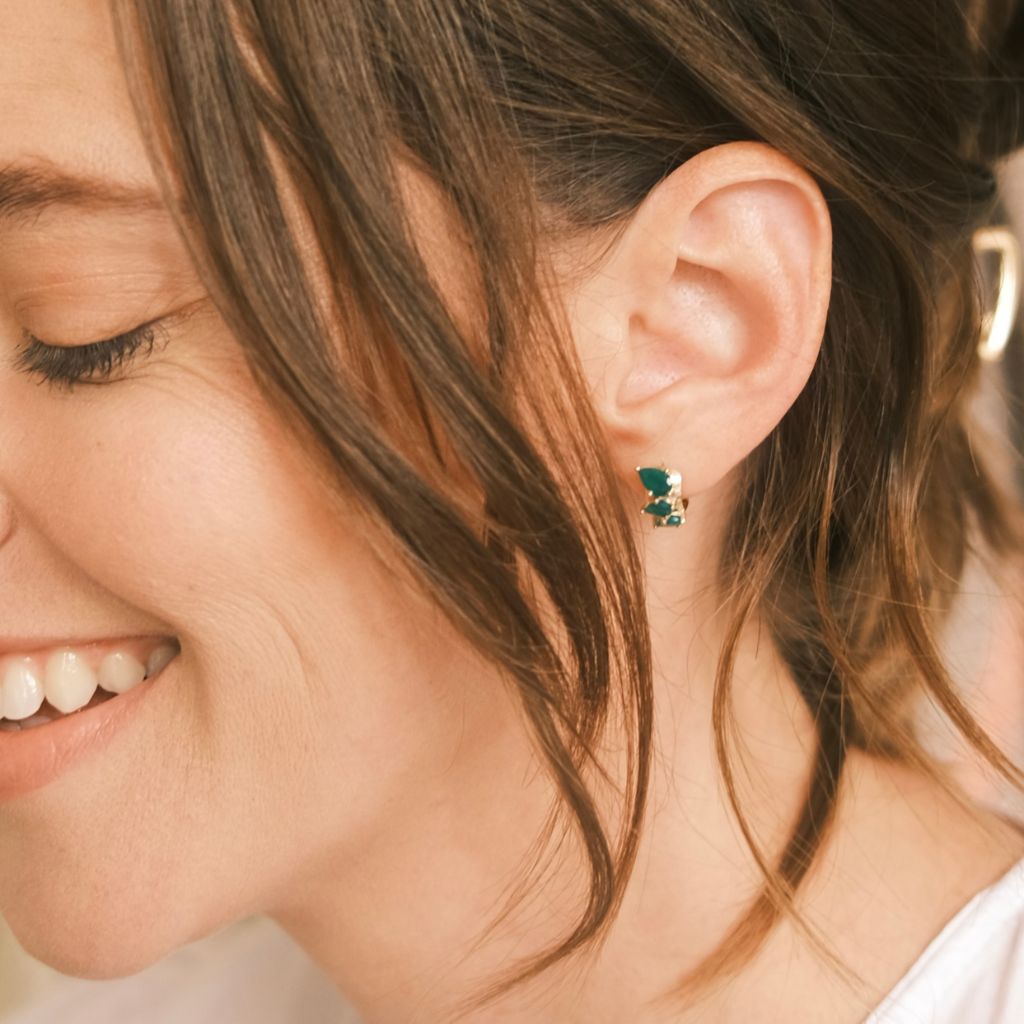 Green onyx pear huggie earrings in 9ct yellow gold worn on ear