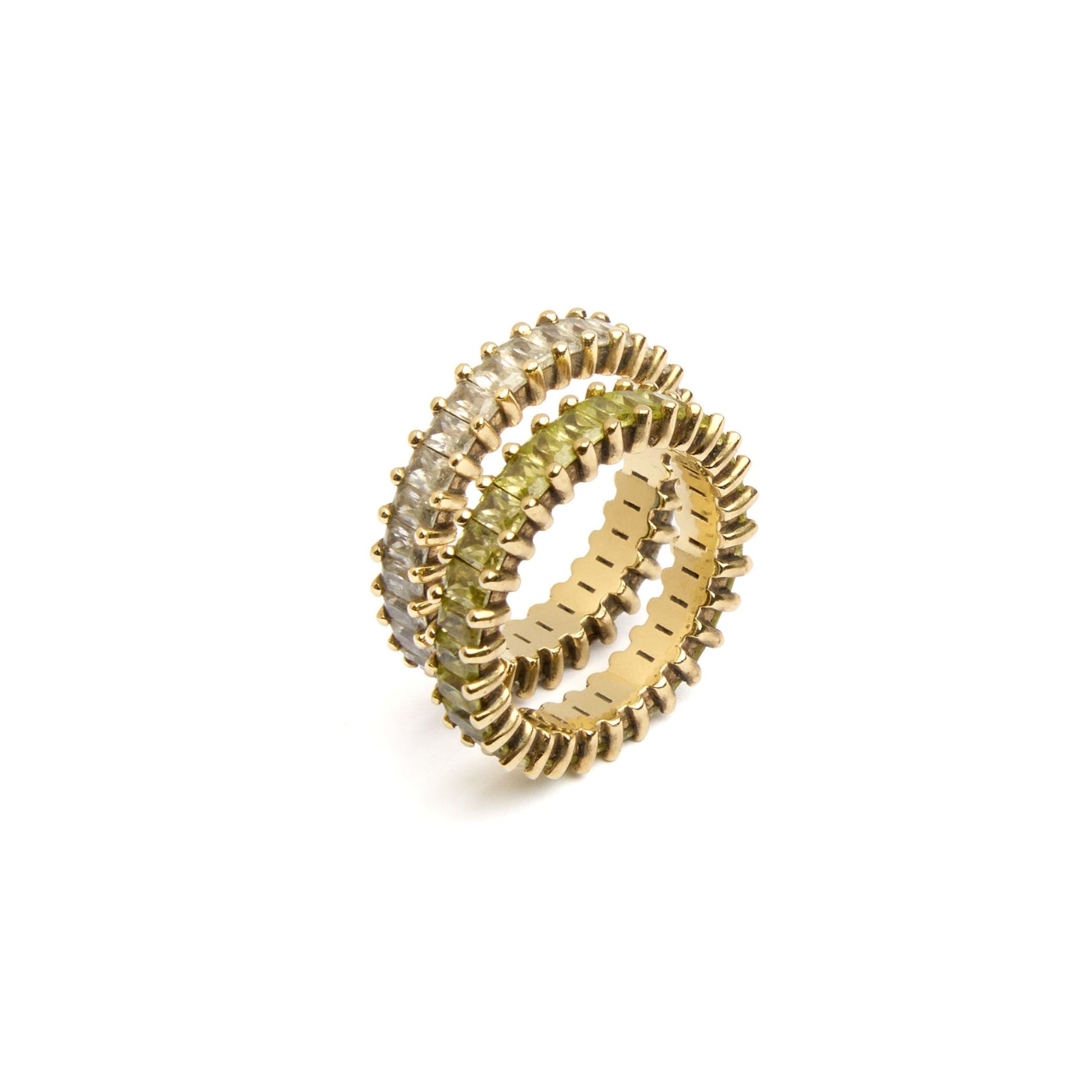 Close-up of stacked baguette eternity rings in yellow gold