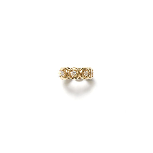 Yellow gold lab grown diamond bezel eternity ring on white background