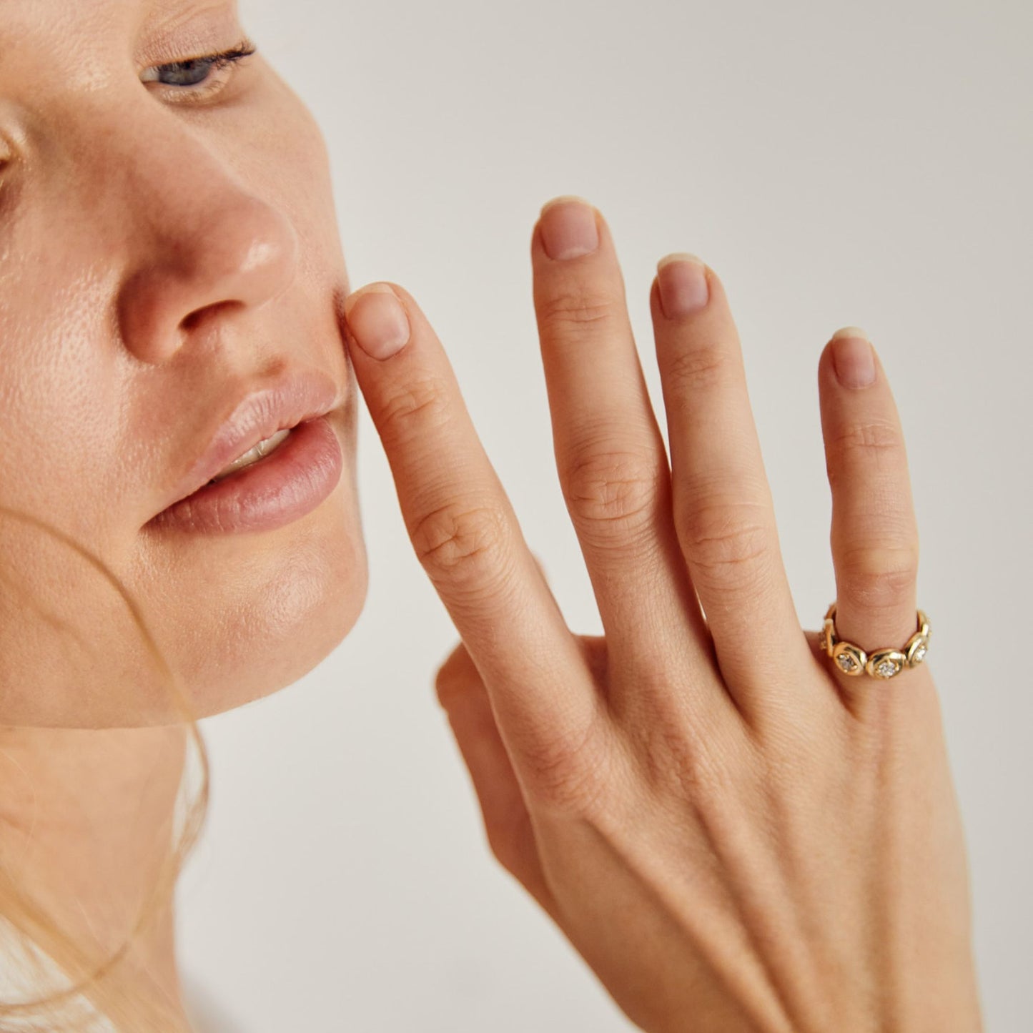 Lab grown diamond bezel eternity ring styled on hand