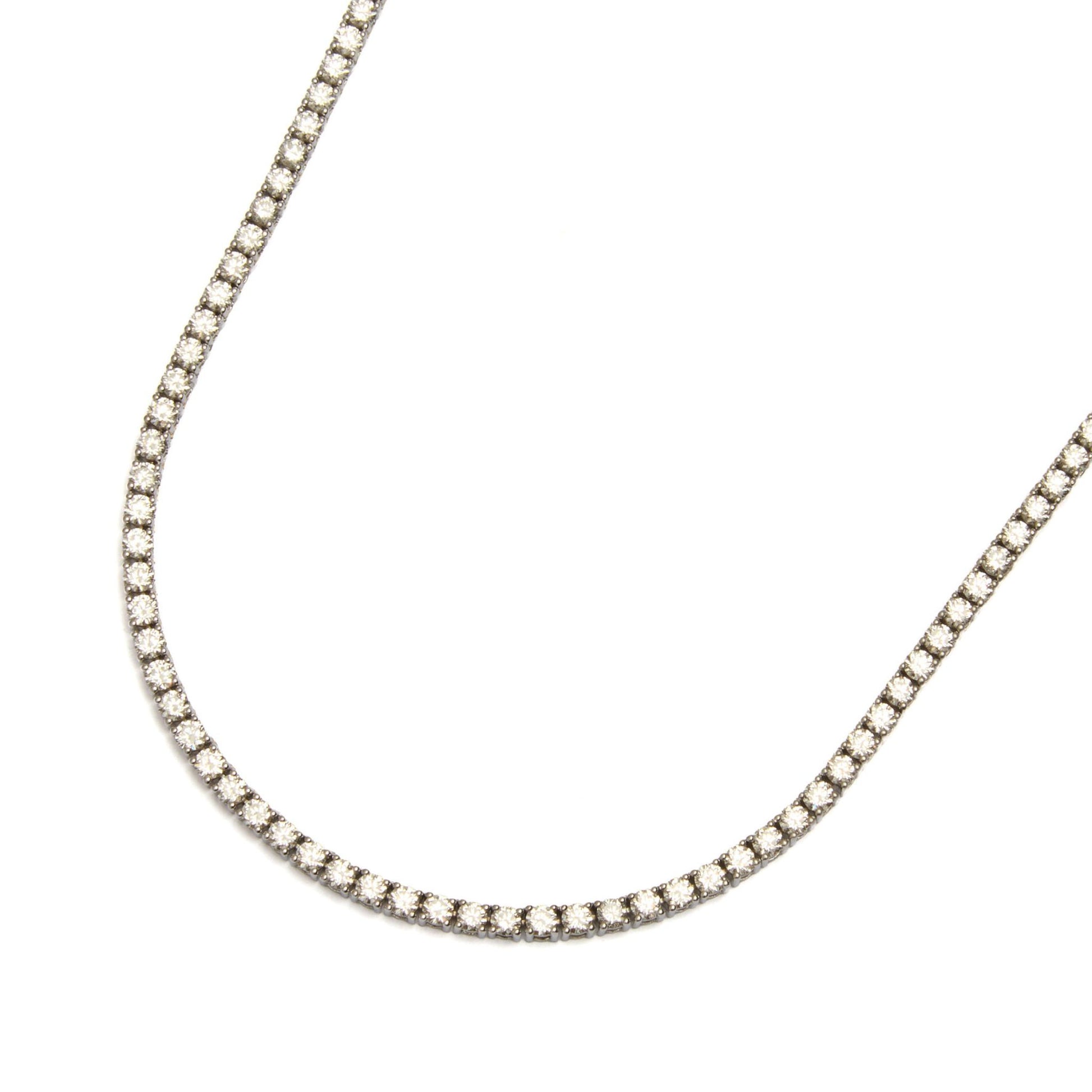 Close-up of a lab grown diamond tennis necklace in solid gold