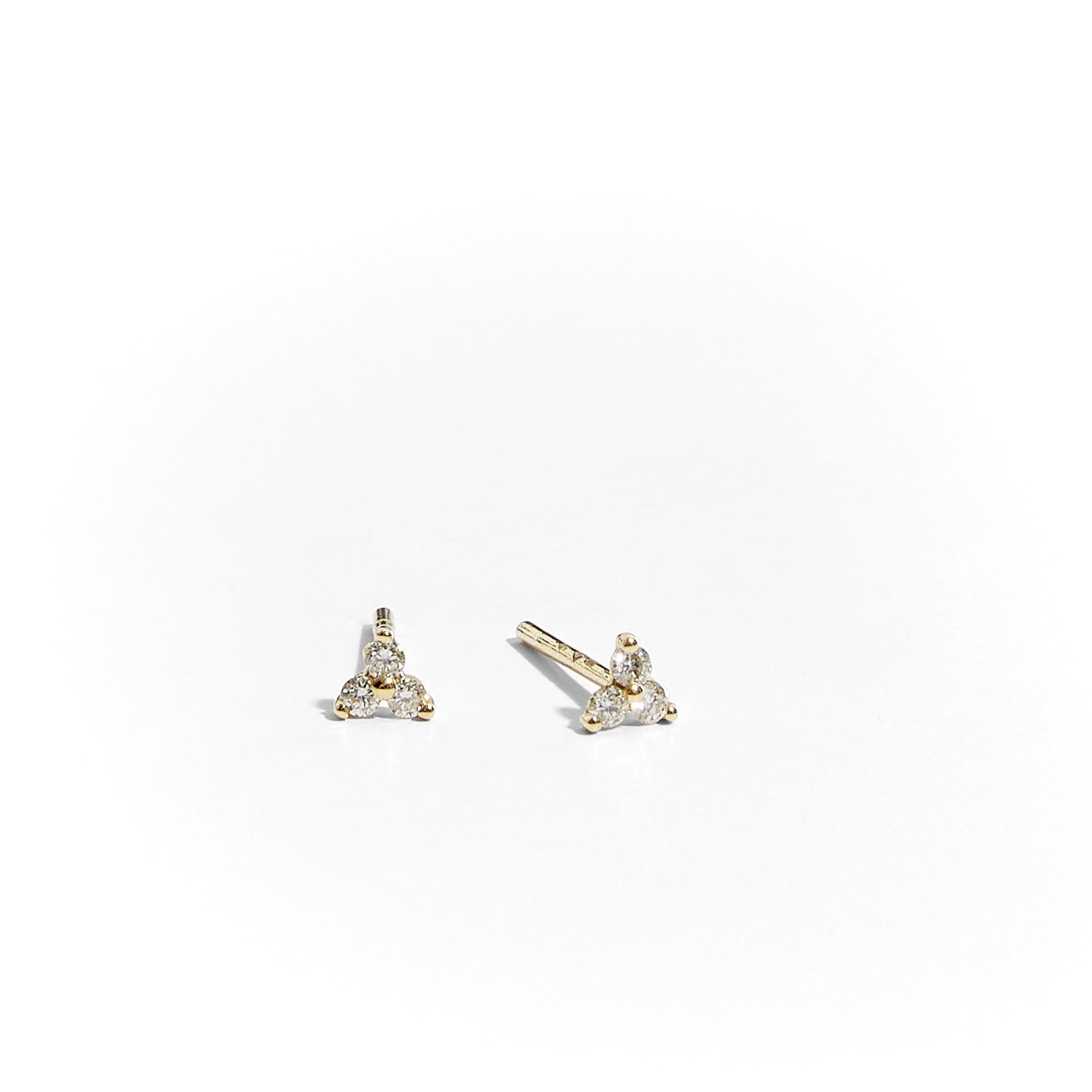 Pair of natural diamond cluster stud earrings in 9ct yellow gold on white background