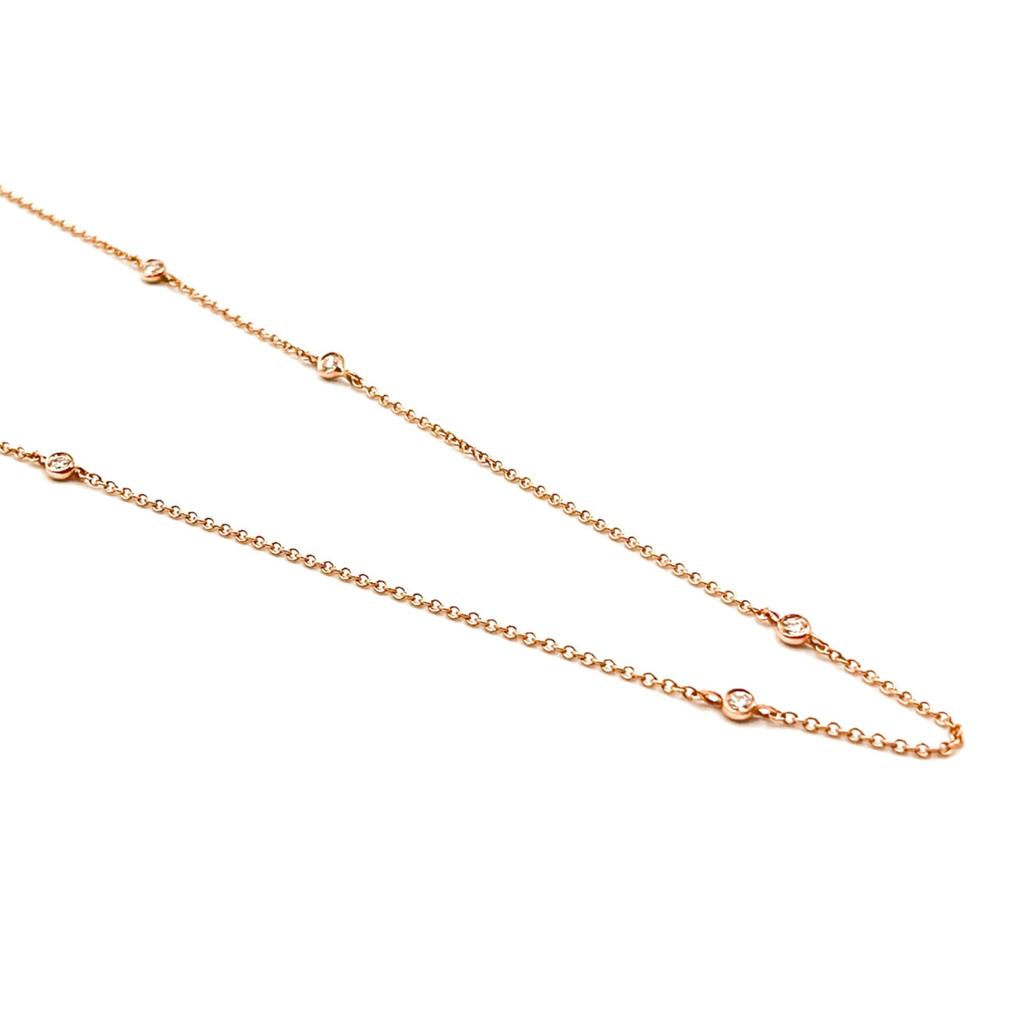 Natural diamond station necklace in 9ct rose gold with five bezel-set diamonds