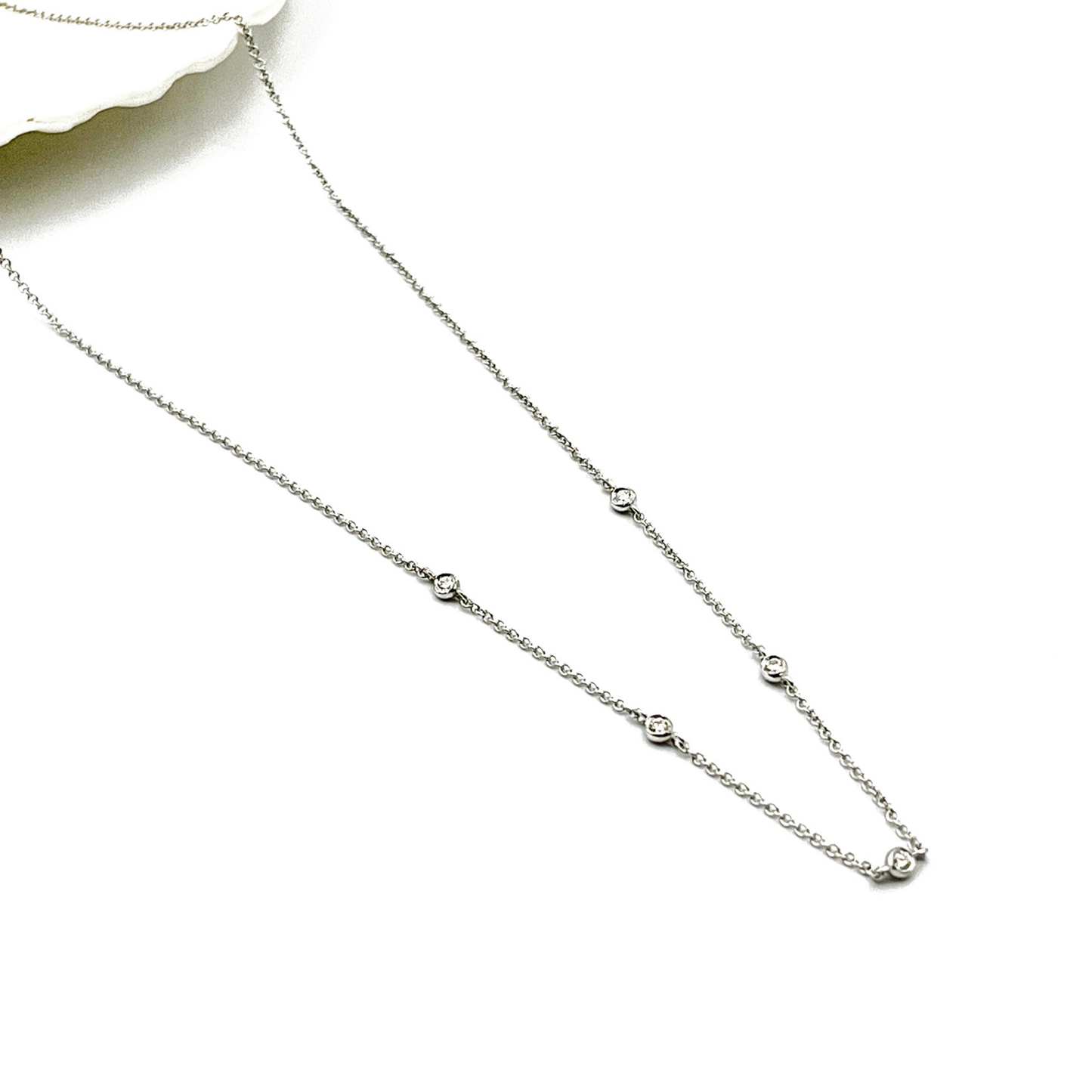 Natural diamond station necklace in 9ct white gold with five bezel-set diamonds