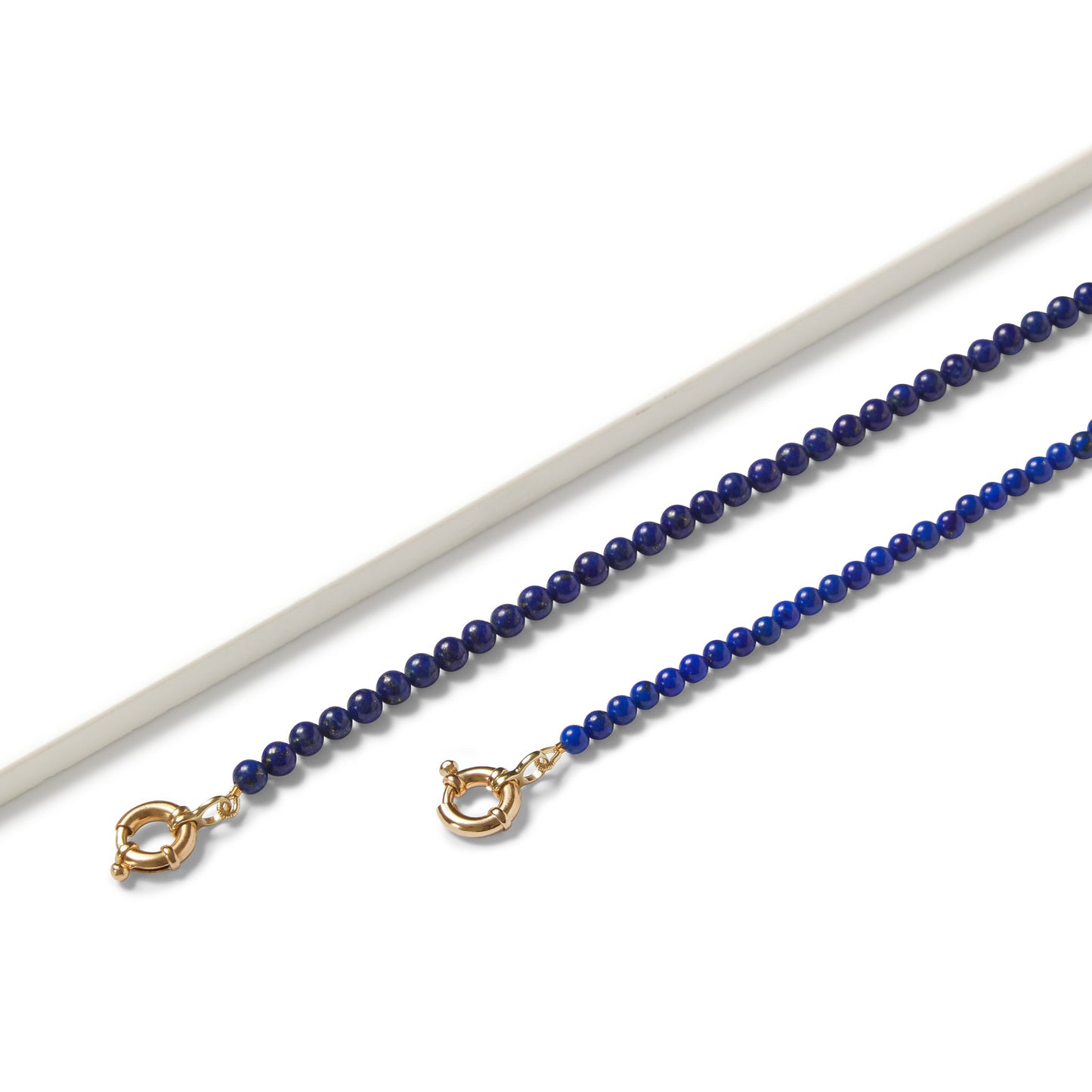 9ct gold lapis lazuli beaded necklace with signoretti clasp — deep blue gemstone strand from Thor Collective’s Colour Your Summer Collection.