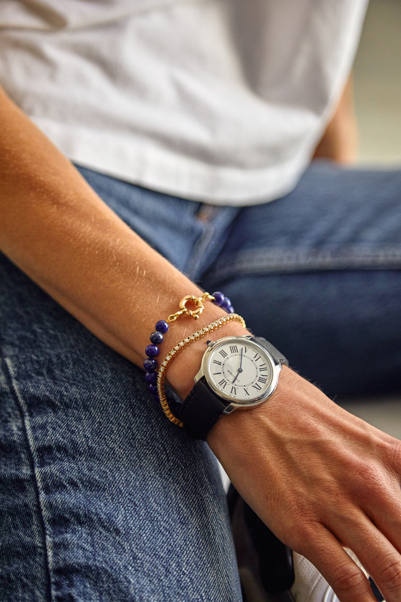 Lapis lazuli bracelet stacked with gold jewellery and watch — bold summer accessory from Thor Collective.