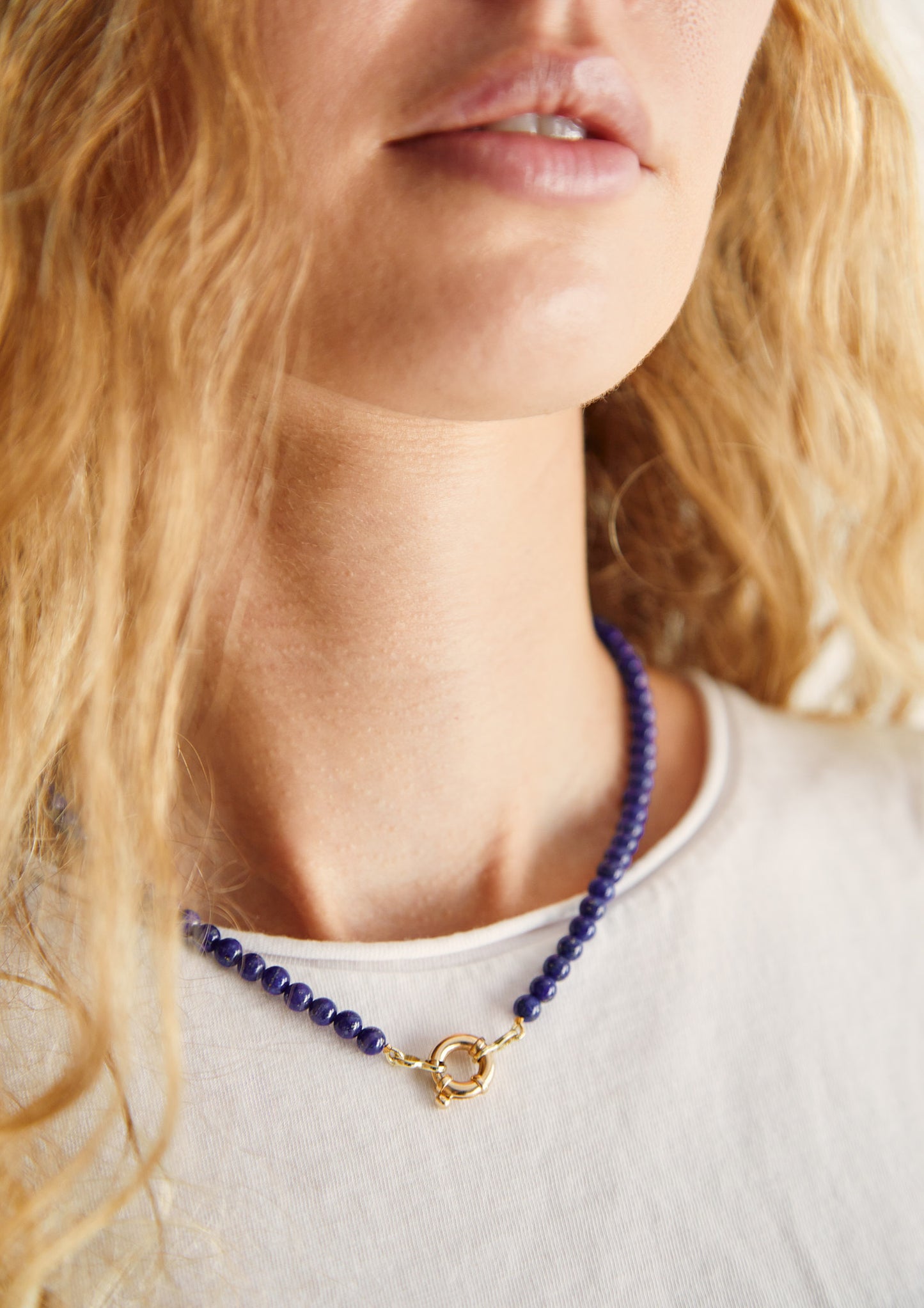 Model wearing 9ct gold lapis lazuli gemstone necklace — simple, chic, and effortlessly modern summer jewellery.