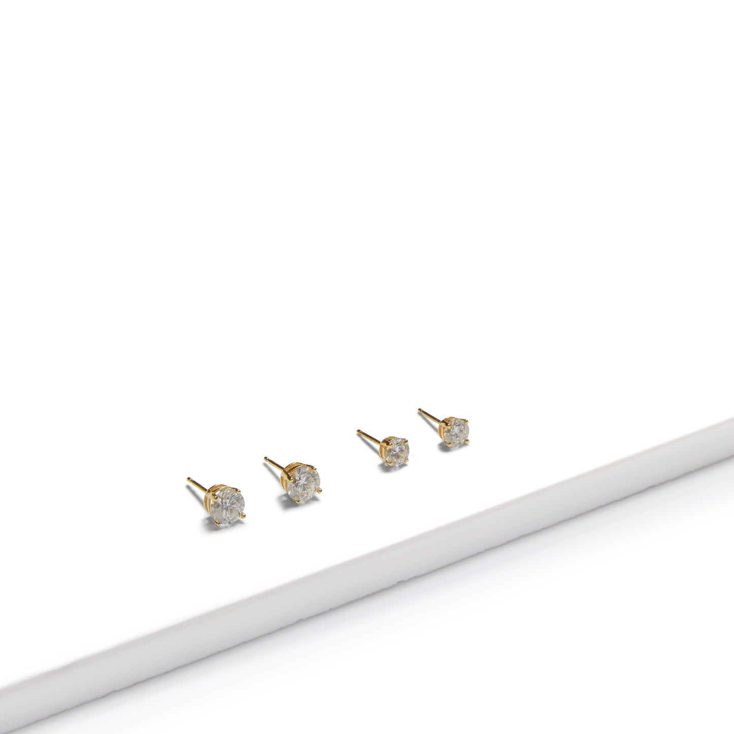 Four 9ct gold lab-grown diamond stud earrings displayed on a white background, showcasing classic fine jewellery design by Thor Collective.