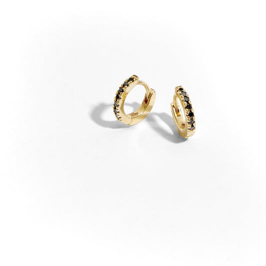 solid gold mini huggi earrings with black diamonds