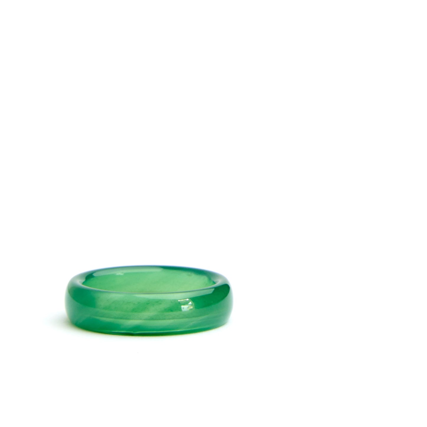 Close-up of hand-carved green agate cigar band ring