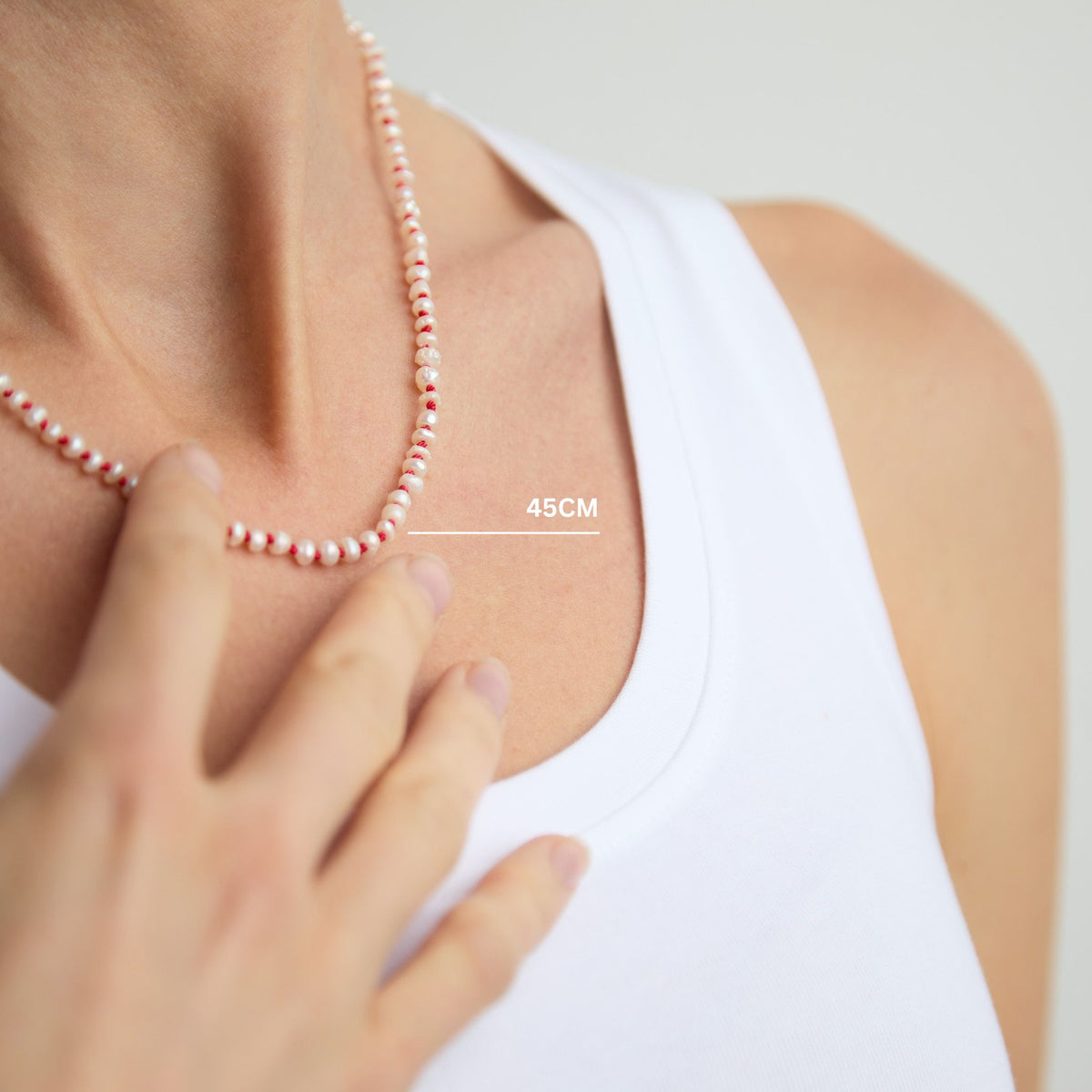The Red Thread freshwater pearl necklace worn at 45cm length