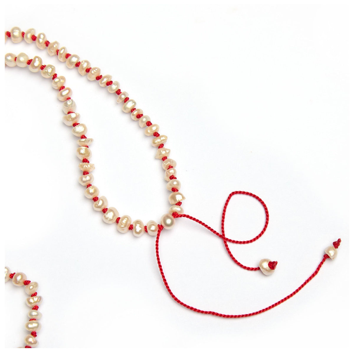 Freshwater pearl necklace with adjustable red thread cord