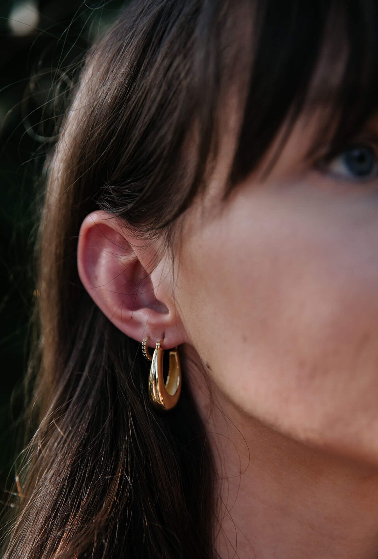 black diamond and yellow gold huggie earrings